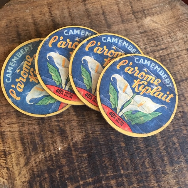 White Calla Lily wooden Coasters on blue background